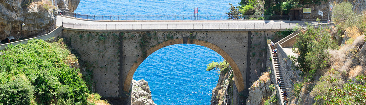 bridge over furore beach amalfi coast